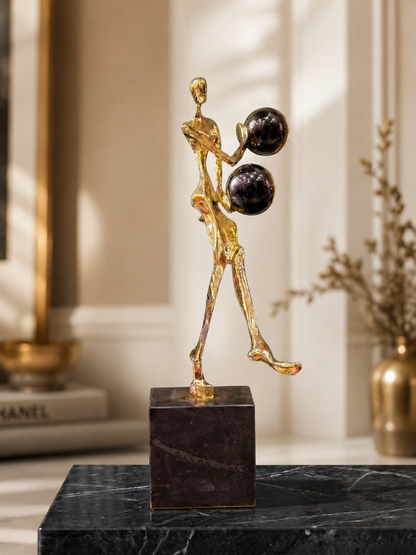 Golden Abstract Human Sculpture with Black Spheres