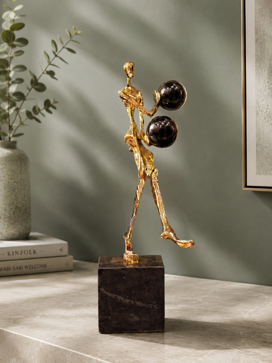 Golden Abstract Human Sculpture with Black Spheres
